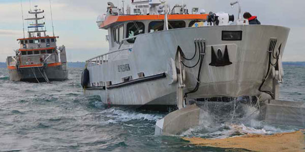 Boats cleaning water surfaces